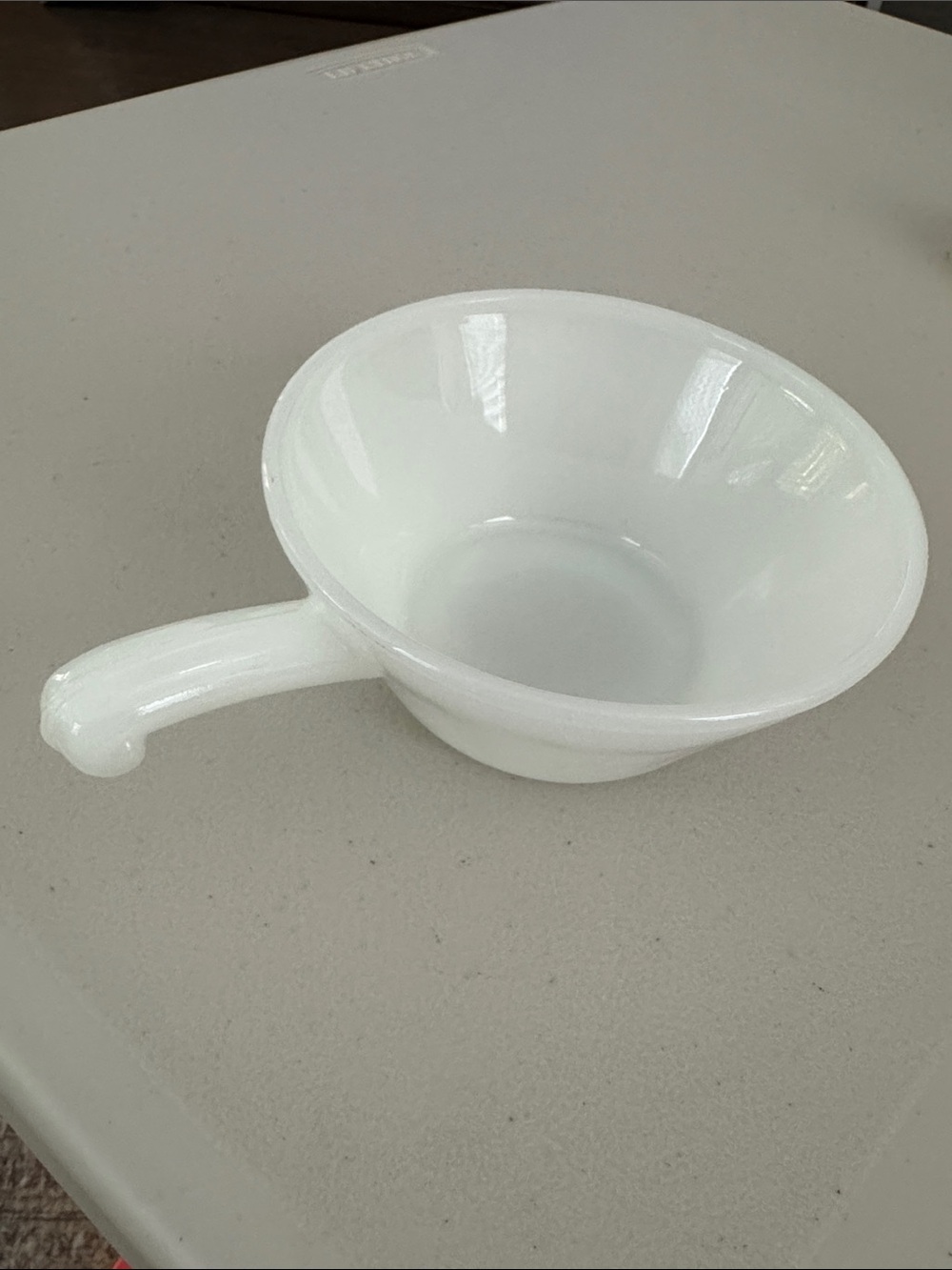 Anchor Hocking Fire King milk glass soup bowl with a classic handle